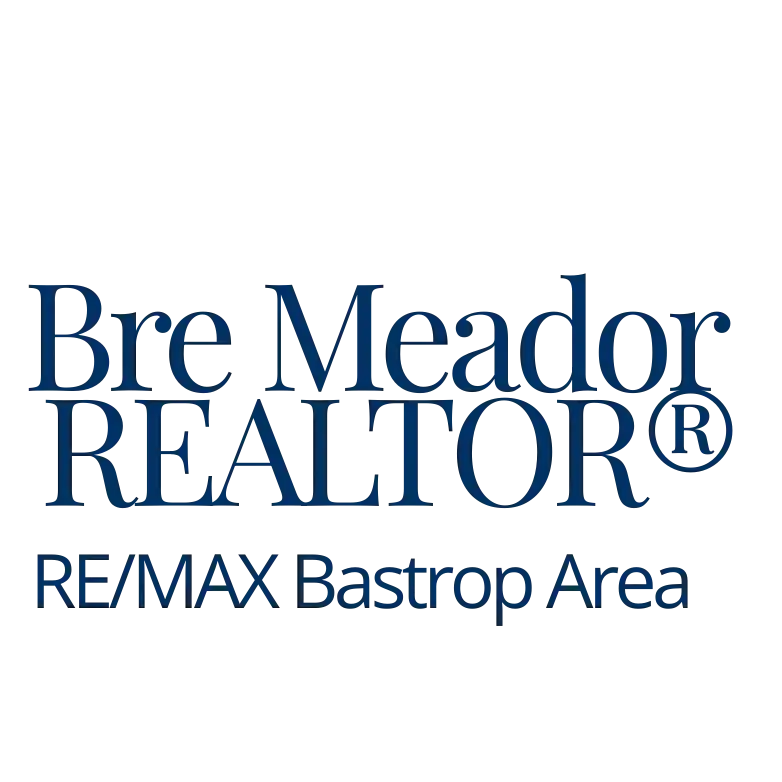 Aerial view of a bridge surrounded by lush greenery.